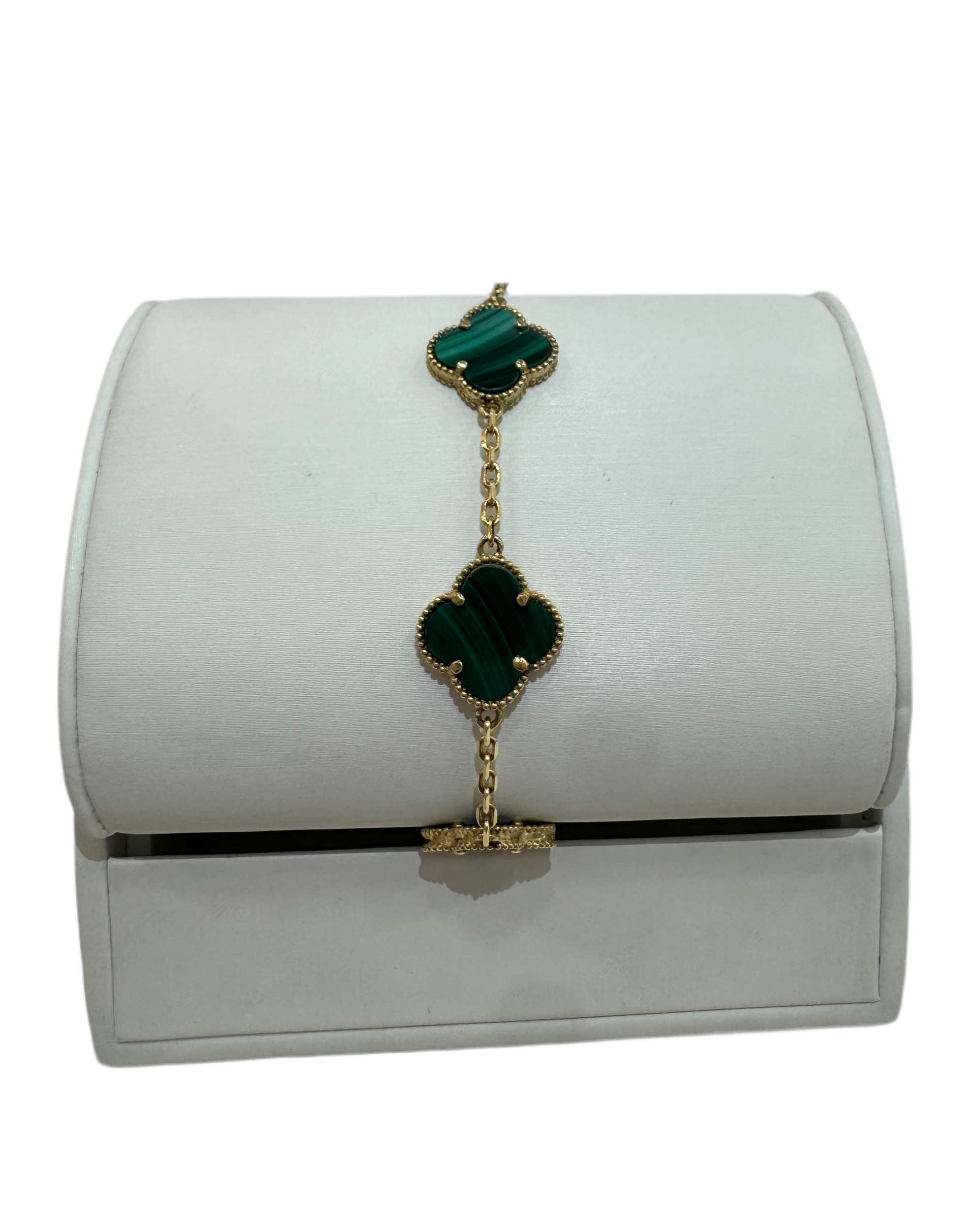 Jasel Jewelry gold bracelet with green clovers and elegant design