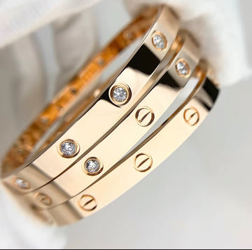 Jasel Jewelry stainless steel thick bangle bracelet in gold, silver, and rose gold finishes